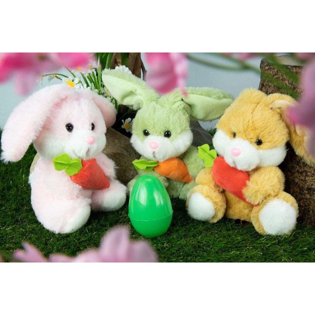 three tiny plush bunnies and a plastic easter egg