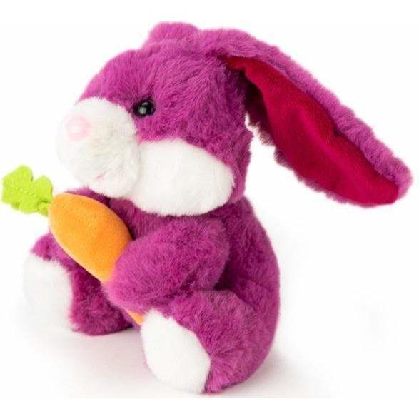 small cute easter bunny holding carrot looking left