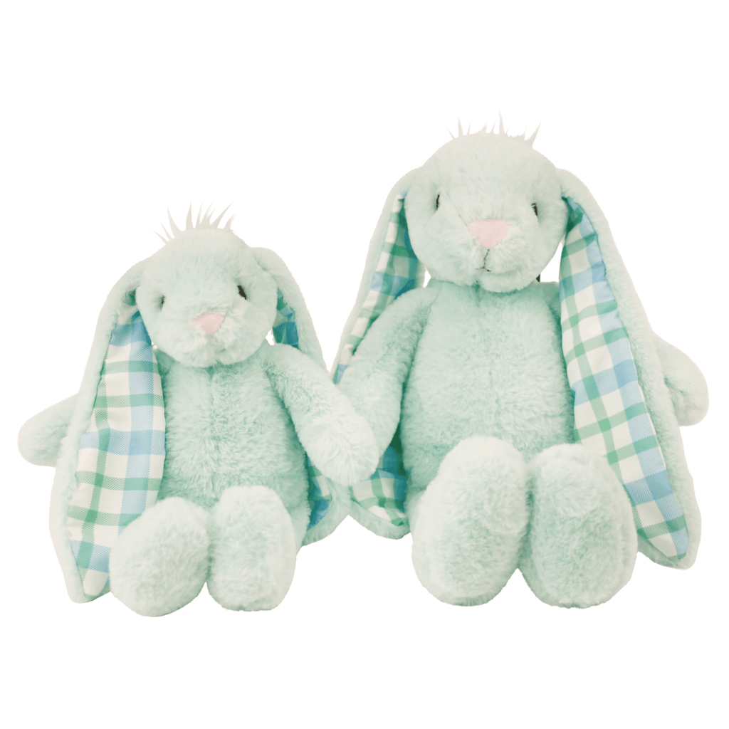 two green stuffed animal rabbits