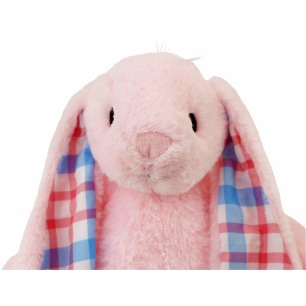 face of big pink stuffed animal rabbit