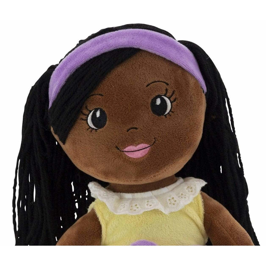 face of rag doll wearing purple headband