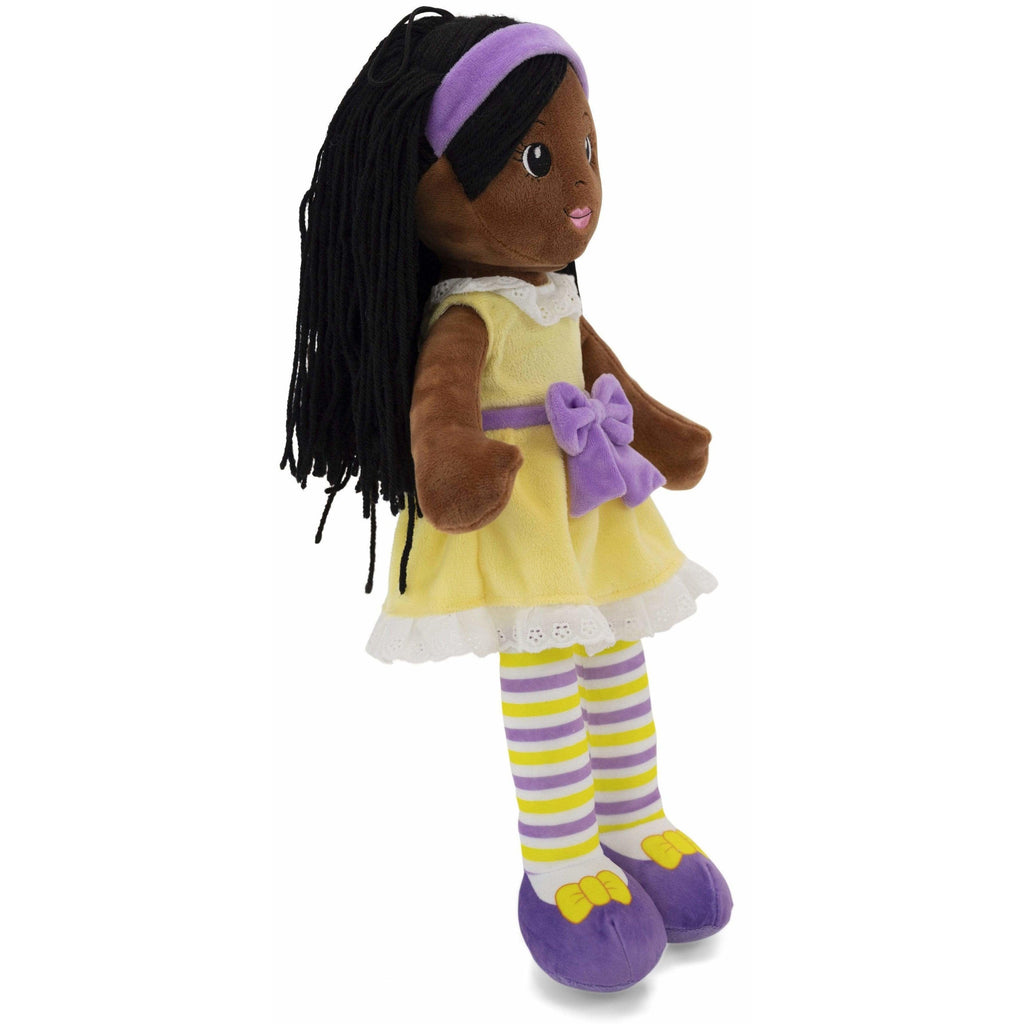 rag doll wearing yellow dress facing right
